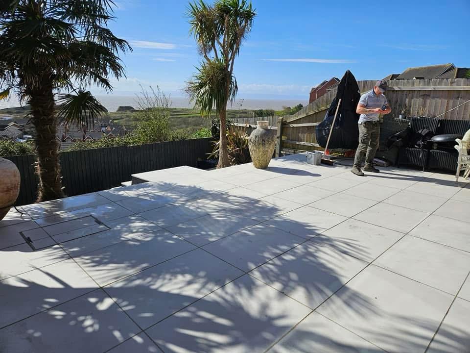 Finished porcelain patio with palm trees and sea view